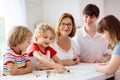 Family playing board game. Kids play Royalty Free Stock Photo