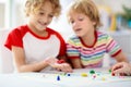 Family playing board game. Kids play Royalty Free Stock Photo