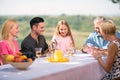 Family playing cards outdoors Royalty Free Stock Photo