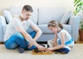 Family playing checkers. Royalty Free Stock Photo