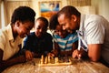 Family playing chess together at home in the living room Royalty Free Stock Photo