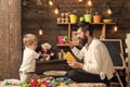 Family playing with constructor at home. Dad and child play with toy cars, bricks. Nursery with toys and chalkboard on Royalty Free Stock Photo