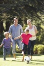 Family Playing Football In Garden Together Royalty Free Stock Photo