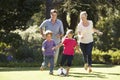 Family Playing Football In Garden Together Royalty Free Stock Photo
