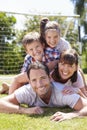 Family Playing Football In Garden Together Royalty Free Stock Photo