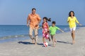 Family Playing Football Soccer on Beach Royalty Free Stock Photo