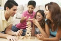 Family Playing Game Together At Home Royalty Free Stock Photo