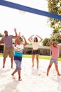 Family Playing Game Of Volleyball In Garden Royalty Free Stock Photo