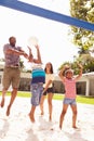 Family Playing Game Of Volleyball In Garden Royalty Free Stock Photo