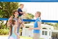 Family Playing Game Of Volleyball In Garden Royalty Free Stock Photo