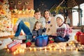 Family playing with gifts on Christmas Day. Royalty Free Stock Photo