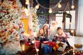 Family playing with gifts indoors on Christmas Day. Royalty Free Stock Photo