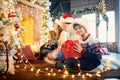 Family playing with gifts indoors on Christmas Day. Royalty Free Stock Photo