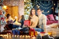 Family playing with gifts indoors on Christmas Day. Royalty Free Stock Photo