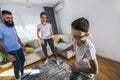 Family playing hide and seek at home, happy boy having fun with mom and dad Royalty Free Stock Photo