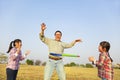 Family playing with hula hoops outdoors Royalty Free Stock Photo