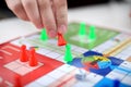 Family playing ludo board game