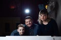 Family playing on the piano. Father and mother teaches son to play a musical instrument Royalty Free Stock Photo