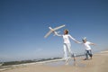 Family playing with plane model