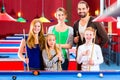 Family playing pool billiard game Royalty Free Stock Photo