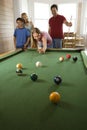 Family Playing Pool in Rec Room Royalty Free Stock Photo