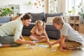 Family Playing Puzzle Game with Special Needs Girl