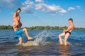 The family is playing in the river on a sunny day. Family Beach Vacation Games, Vacation, Games Royalty Free Stock Photo