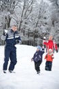 Family playing with snow Royalty Free Stock Photo