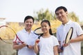 Family playing tennis, portrait Royalty Free Stock Photo