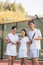 Family playing tennis, portrait Royalty Free Stock Photo