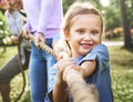 Family playing tug of war Royalty Free Stock Photo