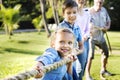 Family playing tug of war Royalty Free Stock Photo