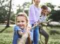 Family playing tug of war Royalty Free Stock Photo