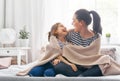 Family playing under blanket