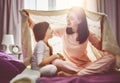 Family playing under blanket