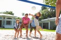 Family Playing Volleyball In Garden At Home Royalty Free Stock Photo