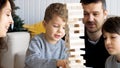 Family is playing in wooden tower at home Royalty Free Stock Photo