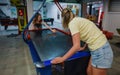 Family plays air hockey