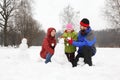 Family plays in park in winter