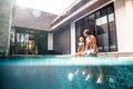 Family in the pool, split underwater