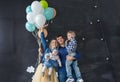 Family portrait with balloons in the studio Royalty Free Stock Photo