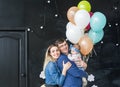 Family portrait with balloons in the studio Royalty Free Stock Photo