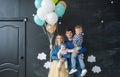 Family portrait with balloons in the studio Royalty Free Stock Photo