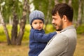 Family portrait. Father play with his child. Father holding a child in his arms. They are happy. Happy family walking outdoor Royalty Free Stock Photo