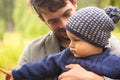 Family portrait. Father play with his child. Father holding a child in his arms. They are happy. Happy family walking outdoor Royalty Free Stock Photo