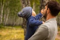 Family portrait. Father play with his child. Father holding a child in his arms. They are happy. Happy family walking outdoor Royalty Free Stock Photo