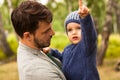 Family portrait. Father play with his child. Father holding a child in his arms. They are happy. Happy family walking outdoor Royalty Free Stock Photo