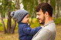 Family portrait. Father play with his child. Father holding a child in his arms. They are happy. Happy family walking outdoor Royalty Free Stock Photo