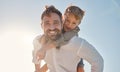 Family, portrait and father and son relax against a blue sky background, playing and having fun outdoors. Happy family Royalty Free Stock Photo