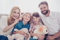 Family portrait of four. Happy parents and thier cheerful kids b Royalty Free Stock Photo